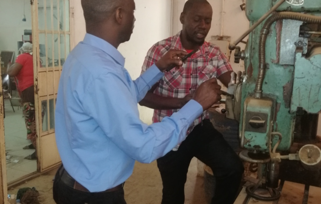 Mr. Nounagnon Hector Alexandre Vignon from Benin (left) with Mr. Demba Jallow, staff at the Mechanical section, GTTI (right)